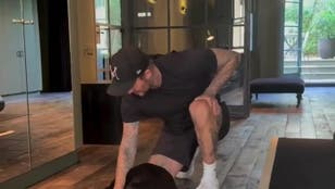 David Beckham flexes dog training skills - but Victoria is not happy