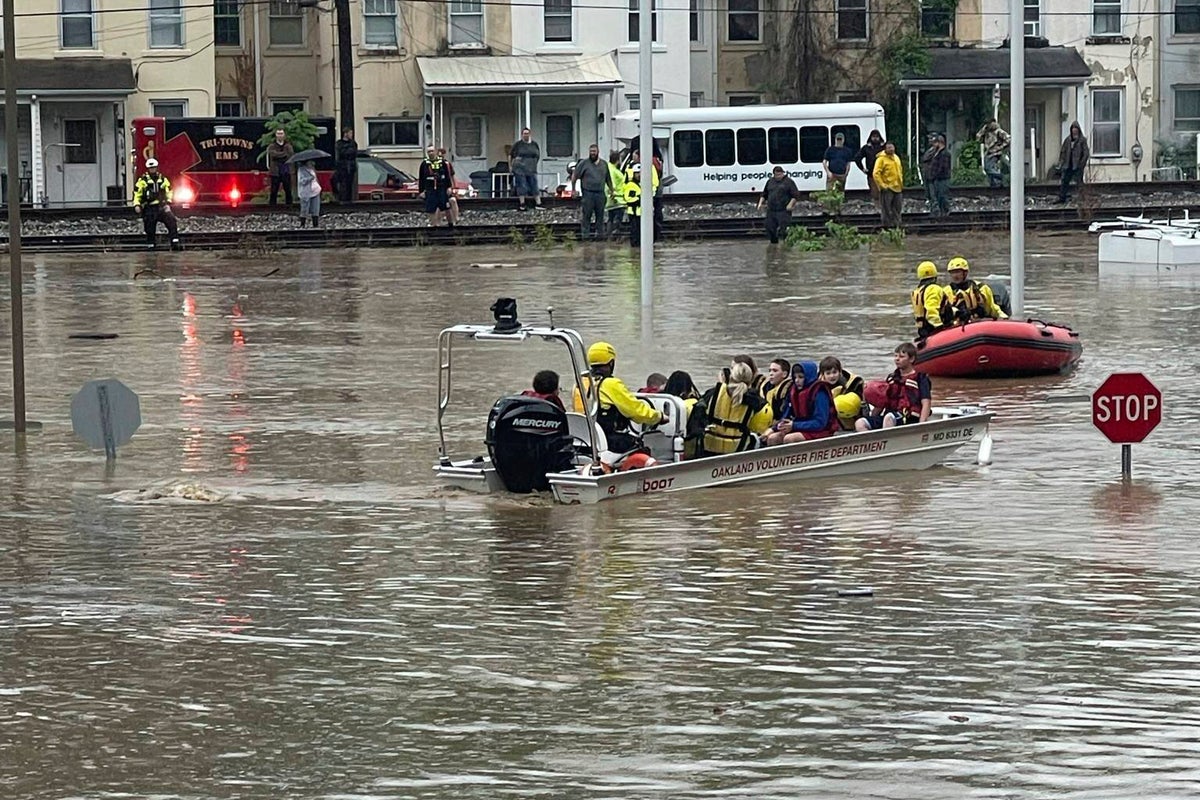150 students and 50 adults are rescued from elementary school after flood waters consume town