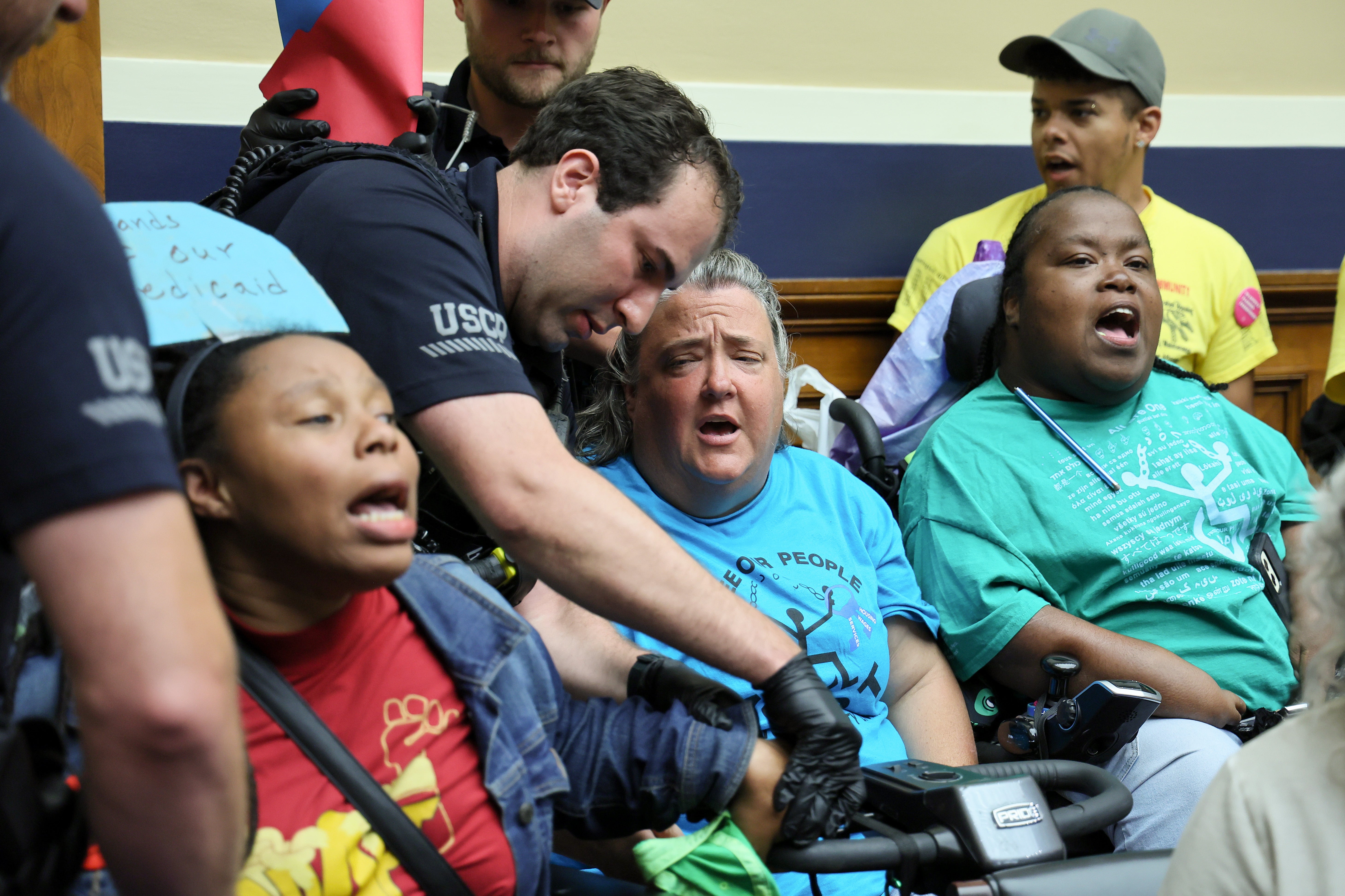 Disability rights advocates protesting inside a House committee hearing on steep cuts to Medicaid were hauled out by police on May 13