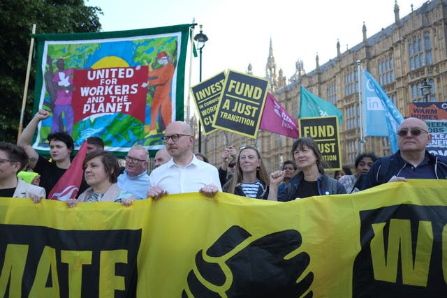Climate activists and trade unionists protest outside Parliament (Angela Christofilou/Greenpeace/PA)
