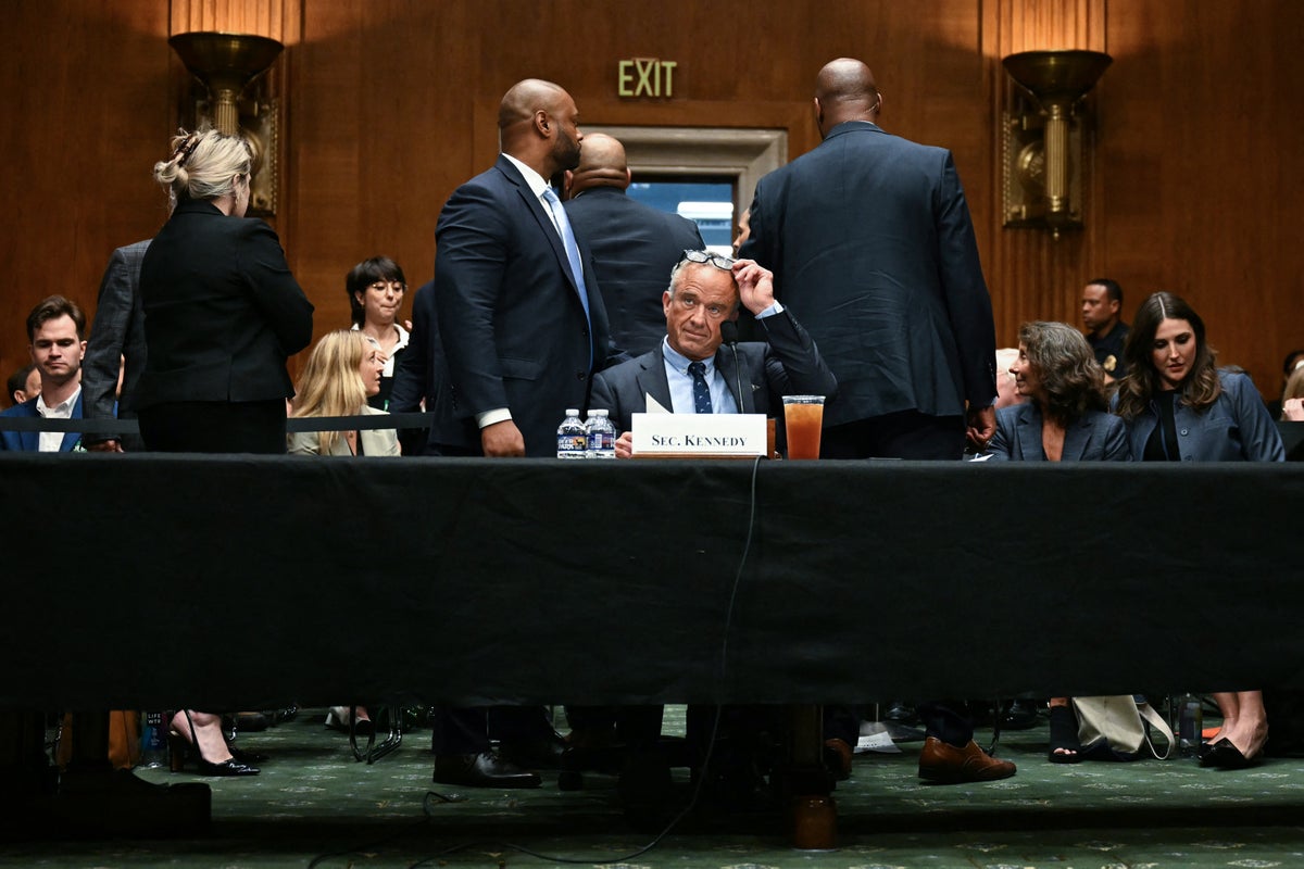 RFK Jr visibly startled by protesters amid angry confrontations over cuts and vaccines at health hearing