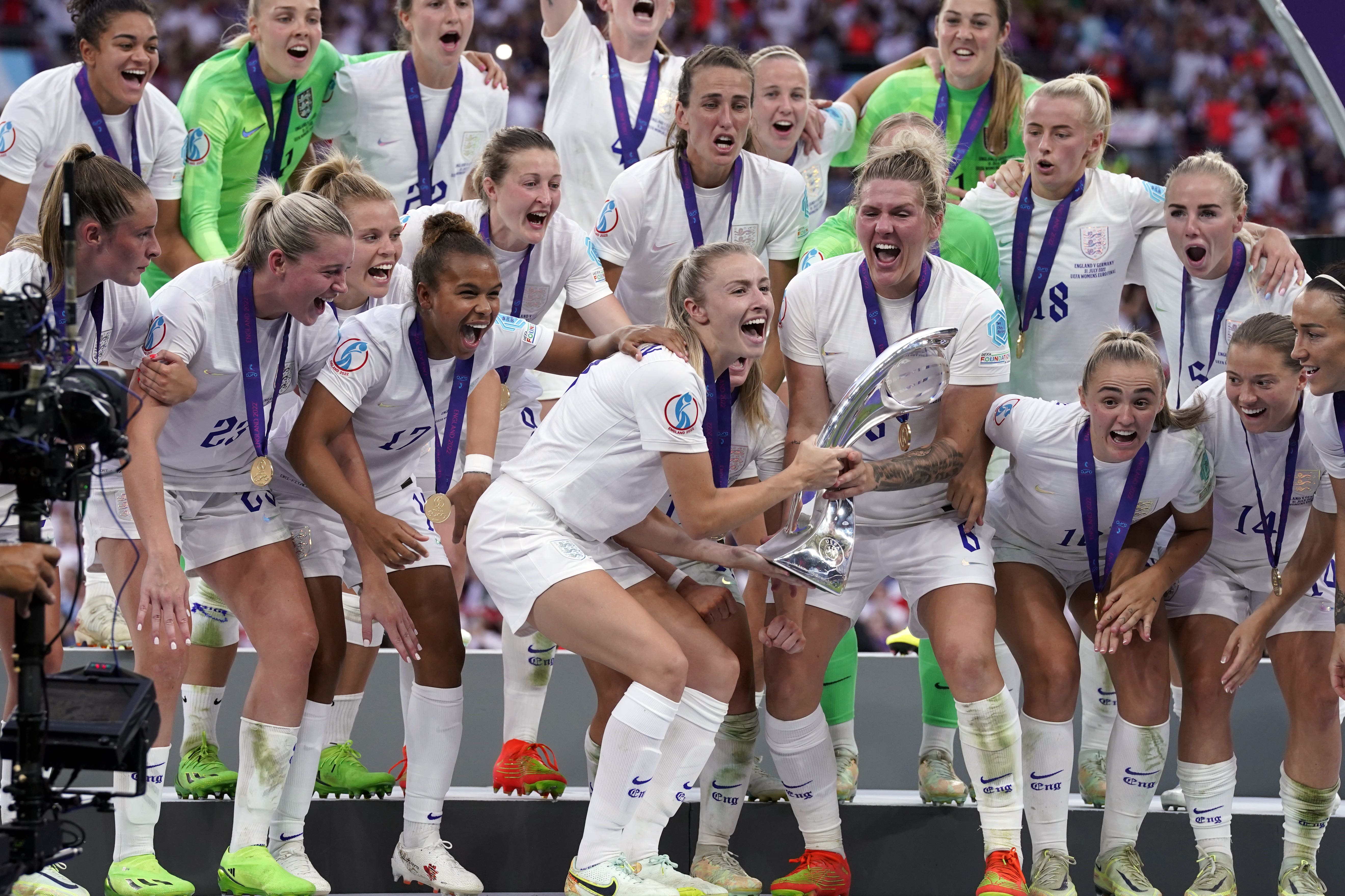England’s Leah Williamson and Millie Bright celebrate with the trophy following victory over Germany in the Uefa Women’s Euro 2022 final at Wembley Stadium (Danny Lawson/PA)