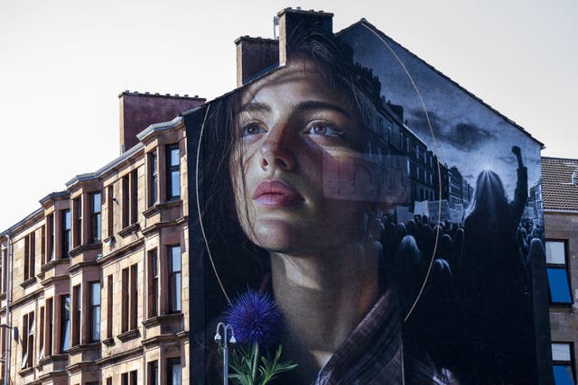 A new mural reimagining the iconic Govan activist Mary Barbour as a modern-day campaigner has been unveiled on the gable end of 1198 Govan Road, Glasgow (Jane Barlow/PA)