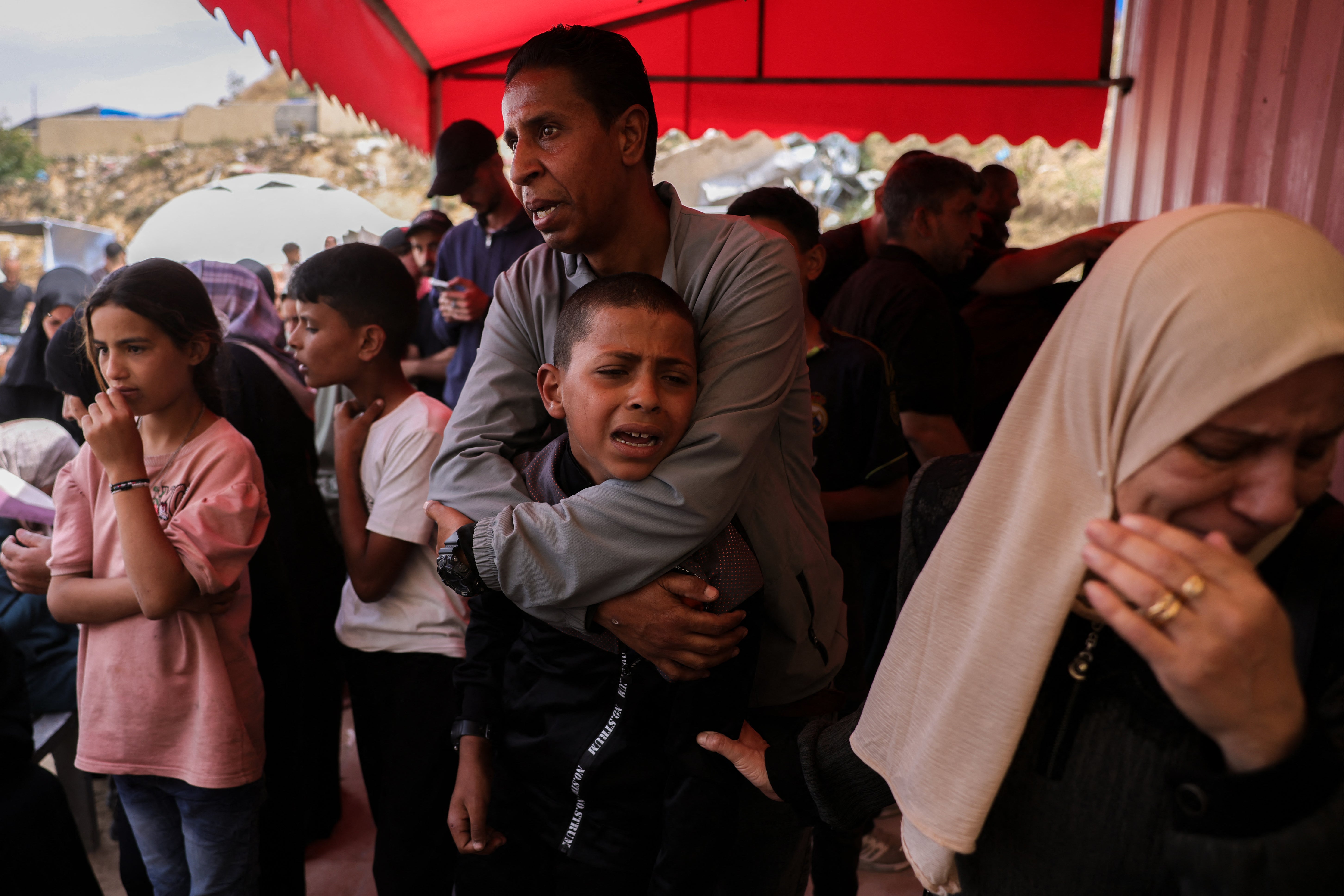 A boy mourns victims of Thursday's Israeli strikes on Gaza