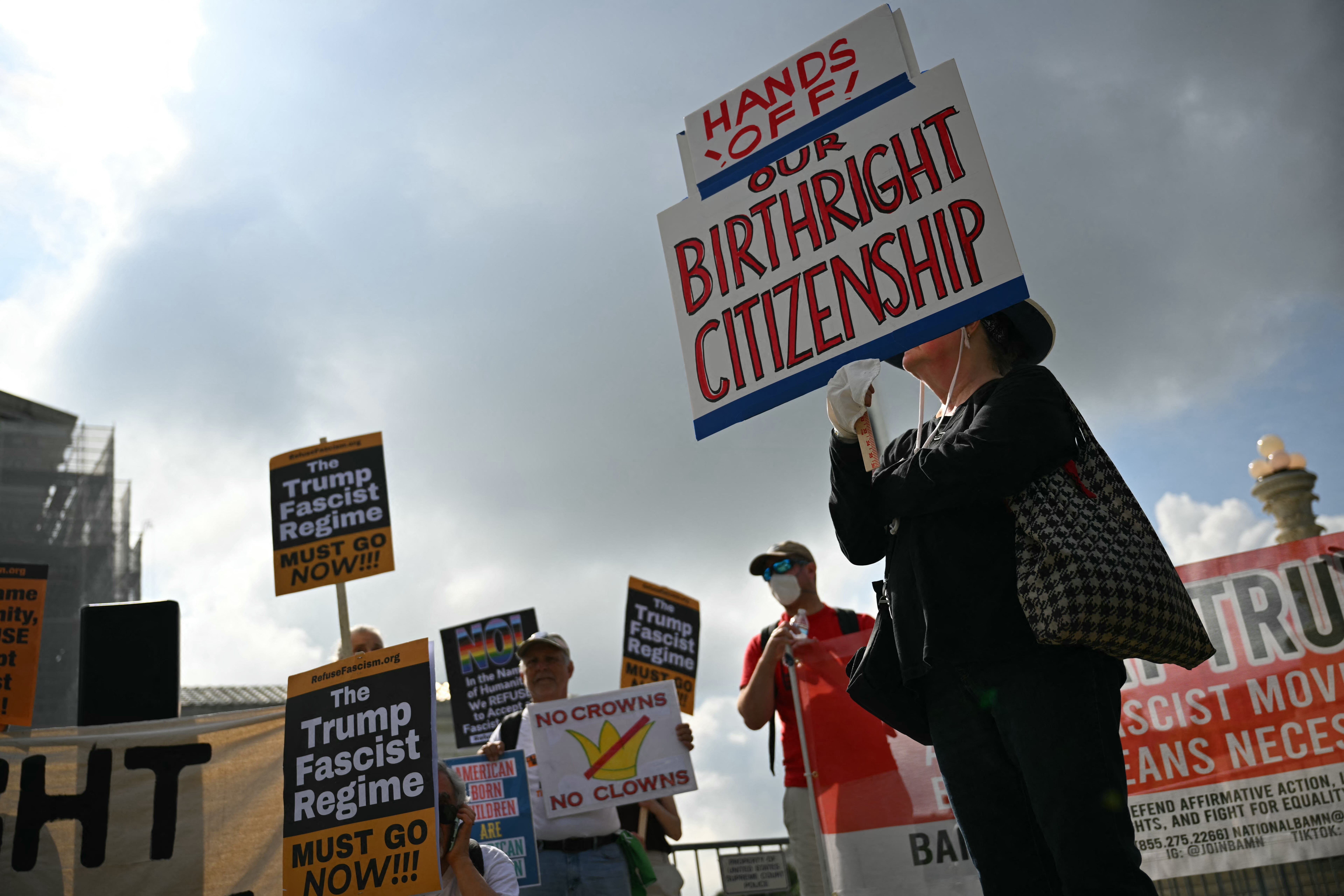 Protesters outside the Supreme Court on May 15 blast the Trump administration’s attempt to rollback birthright citizenship, protected under the 14th Amendment