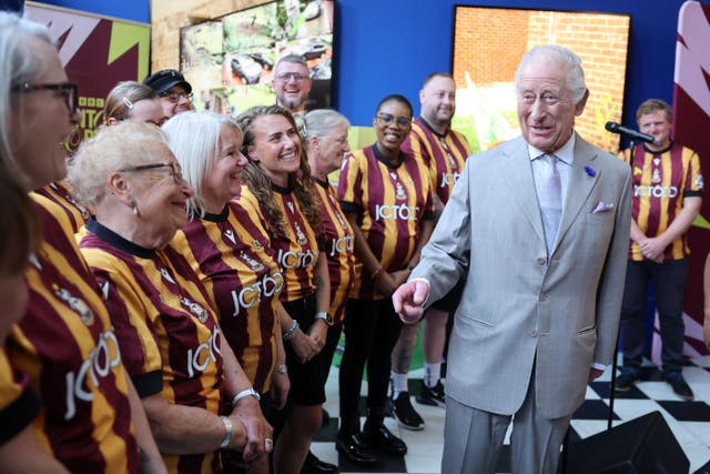 The King meets members of the Bantam of the Opera choir in Bradford (Chris Jackson/PA)