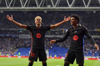 Lamine Yamal celebrates alongside Alex Balde after scoring Barcelona's first goal