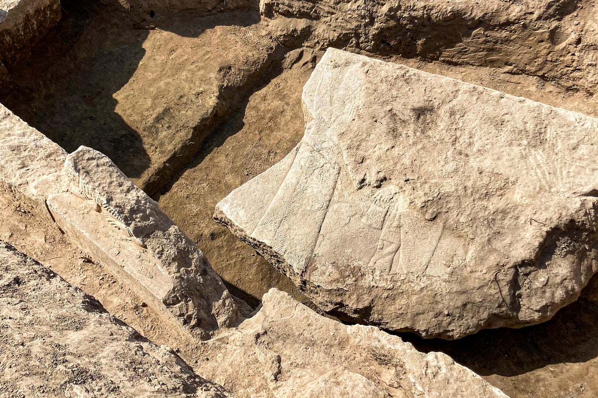 Rare stone carving depicting Assyrian king surrounded by gods unearthed
