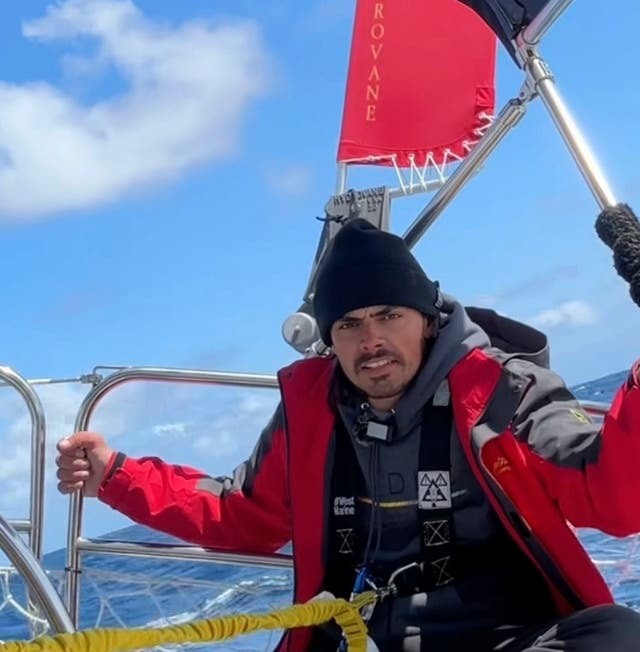 <p>Widger talks to the camera somewhere in the Pacific Ocean as he and his cat, Phoenix, sail from Oregon to Hawaii</p>