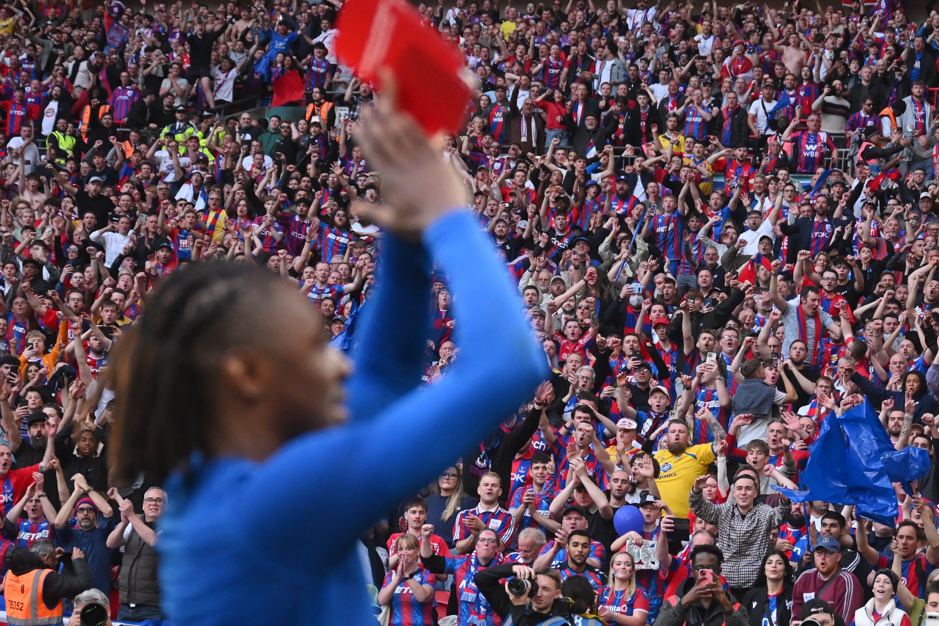 Crystal Palace fans applaud as Eberechi Eze at Wembley after victory over Aston Villa in the semi-finals