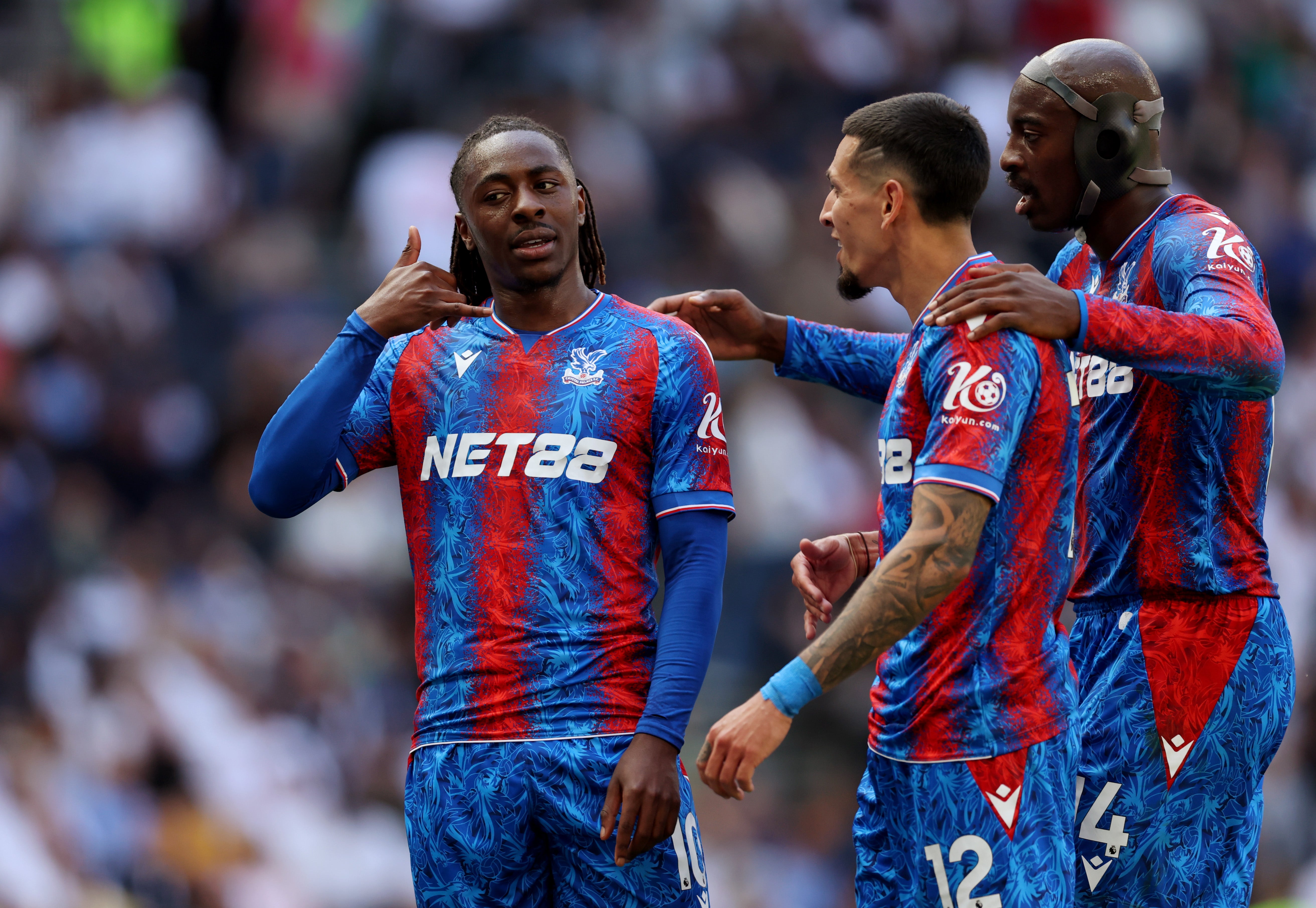 Eberechi Eze of Crystal Palace celebrates with teammates Daniel Munoz and Jean-Philippe Mateta