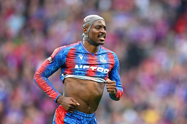 <p>Jean-Philippe Mateta while wearing a protective head mask </p>