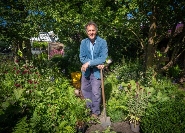 <p>Monty Don poses in the RHS and BBC Radio 2 Dog Garden at the RHS Chelsea Flower Show, which opens at the Royal Hospital Chelsea in London next week</p>