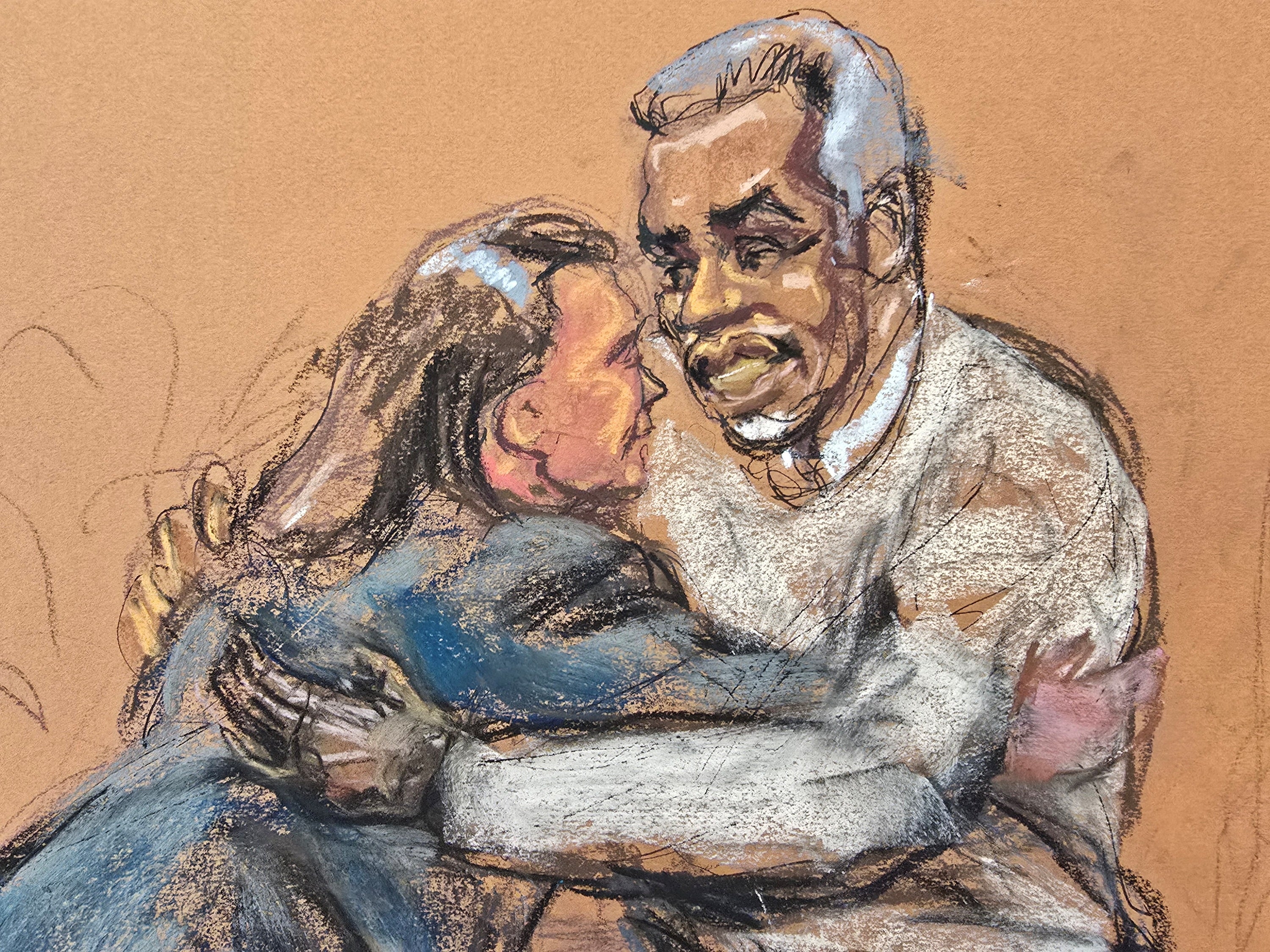 Diddy embraces lawyer Anna Estevao during his trial.