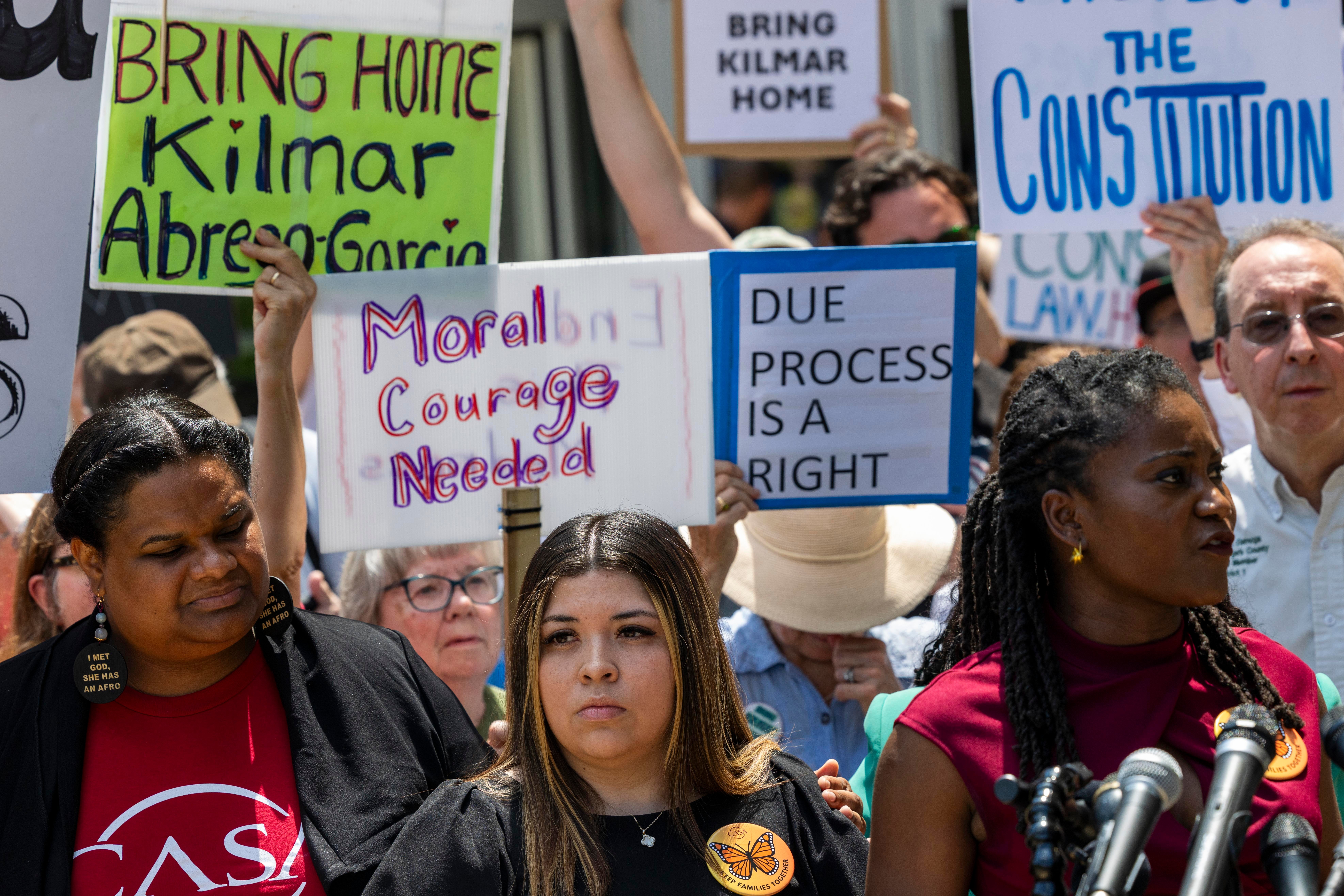 Abrego Garcia’s wife Jennifer Vasquez Sura, center, speaks outside a Maryland courthouse on May 16 as demonstrators gather in support for her husband’s release from a Salvadoran prison
