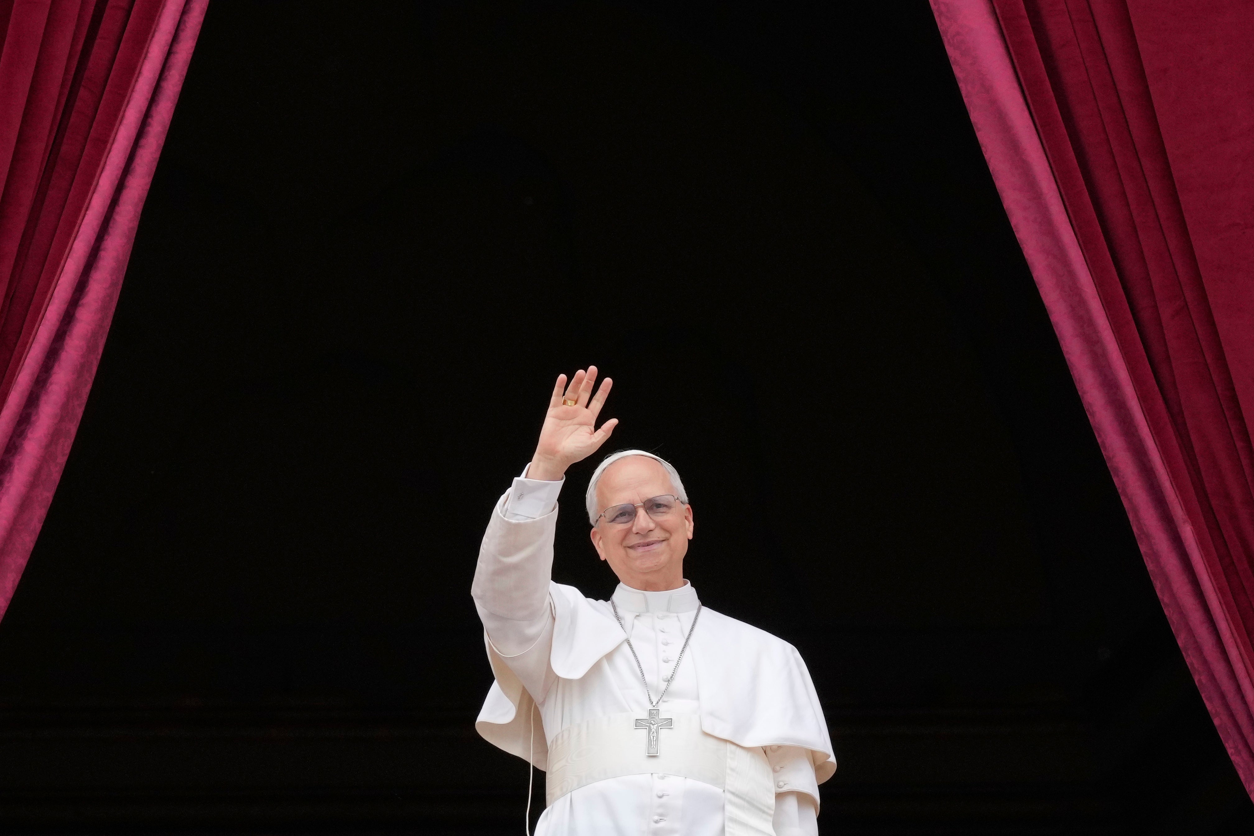 Pope Leo XIV appears on the central balcony of St Peter's Basilica at the Vatican to bless the crowd below on 11 May 2025