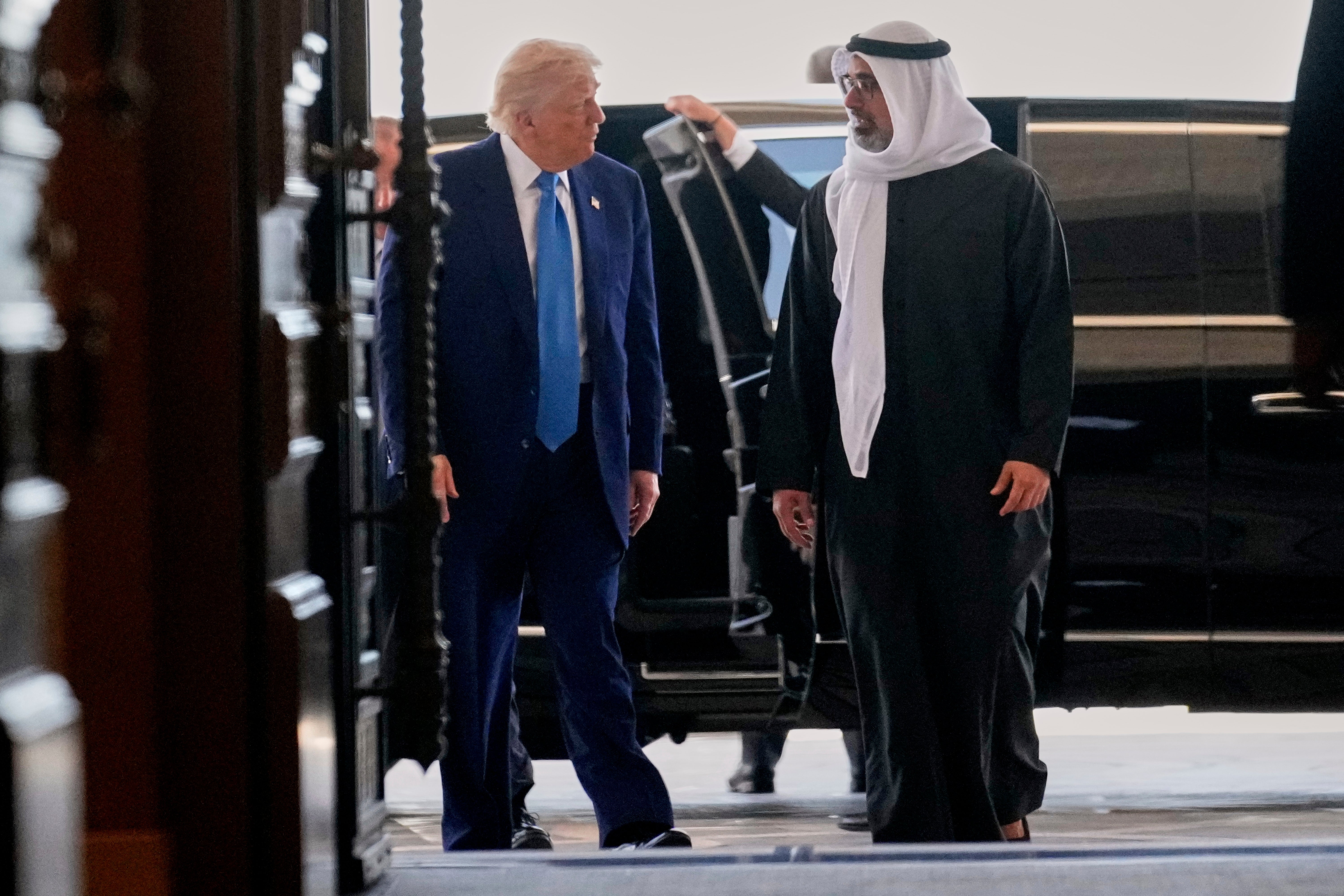 President Donald Trump is greeted by President Mohammed bin Zayed Al Nahyan upon his arrival to participate in a business roundtable at Qasr Al Watan, in Abu Dhab