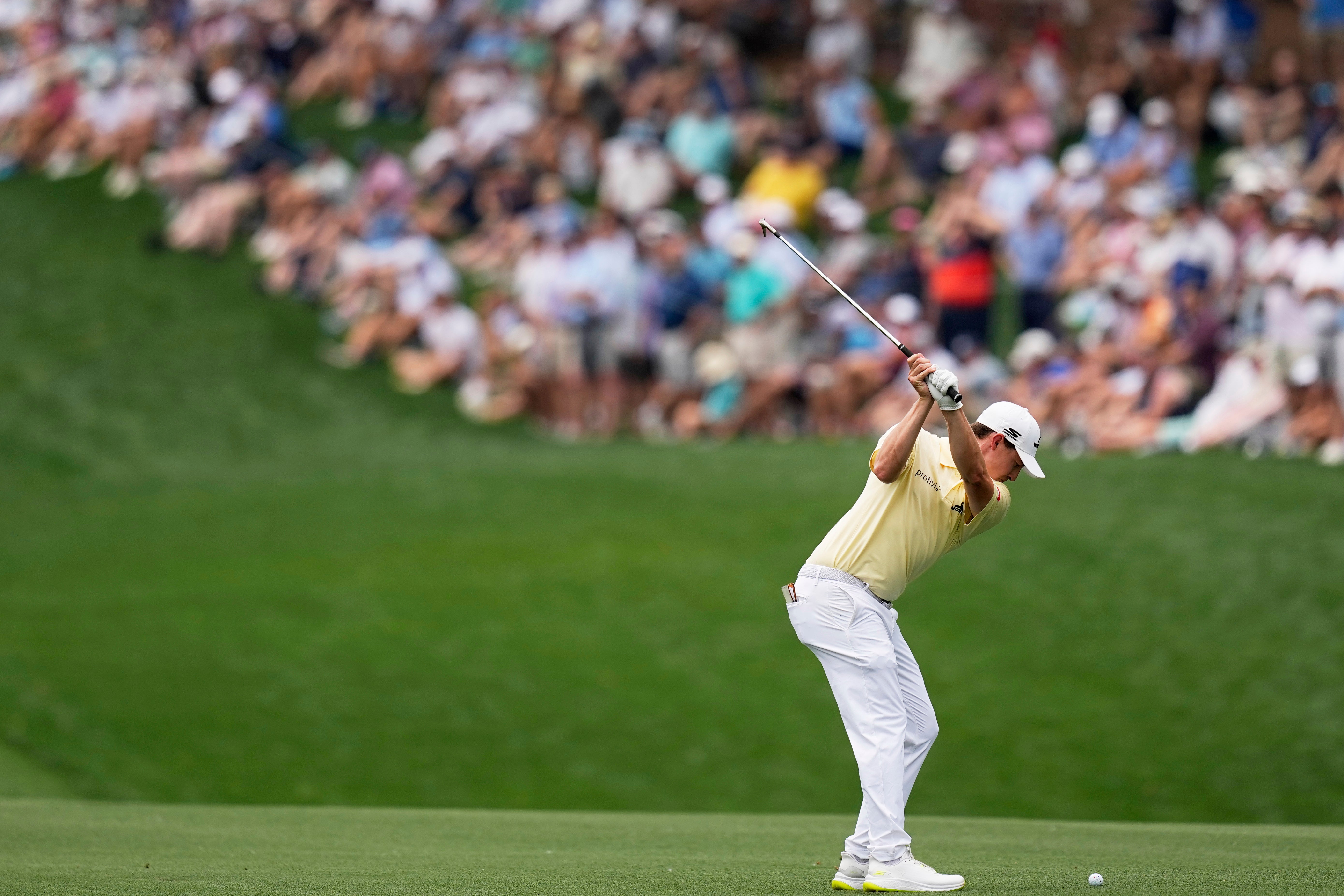 Matt Fitzpatrick hits from the fairway on the first hole during the second round of the US PGA Championship (David J Phillip/AP)