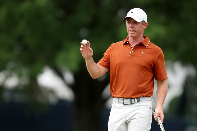 <p>Rory McIlroy of Northern Ireland reacts to a putt on the 10th green</p>