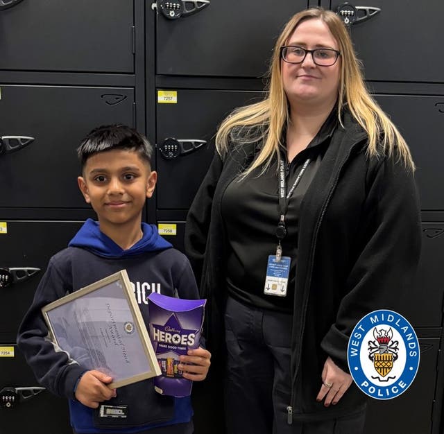 <p>Ayaan Juman with call handler Rebecca Kelly after receiving an award for helping his mother get emergency care</p>