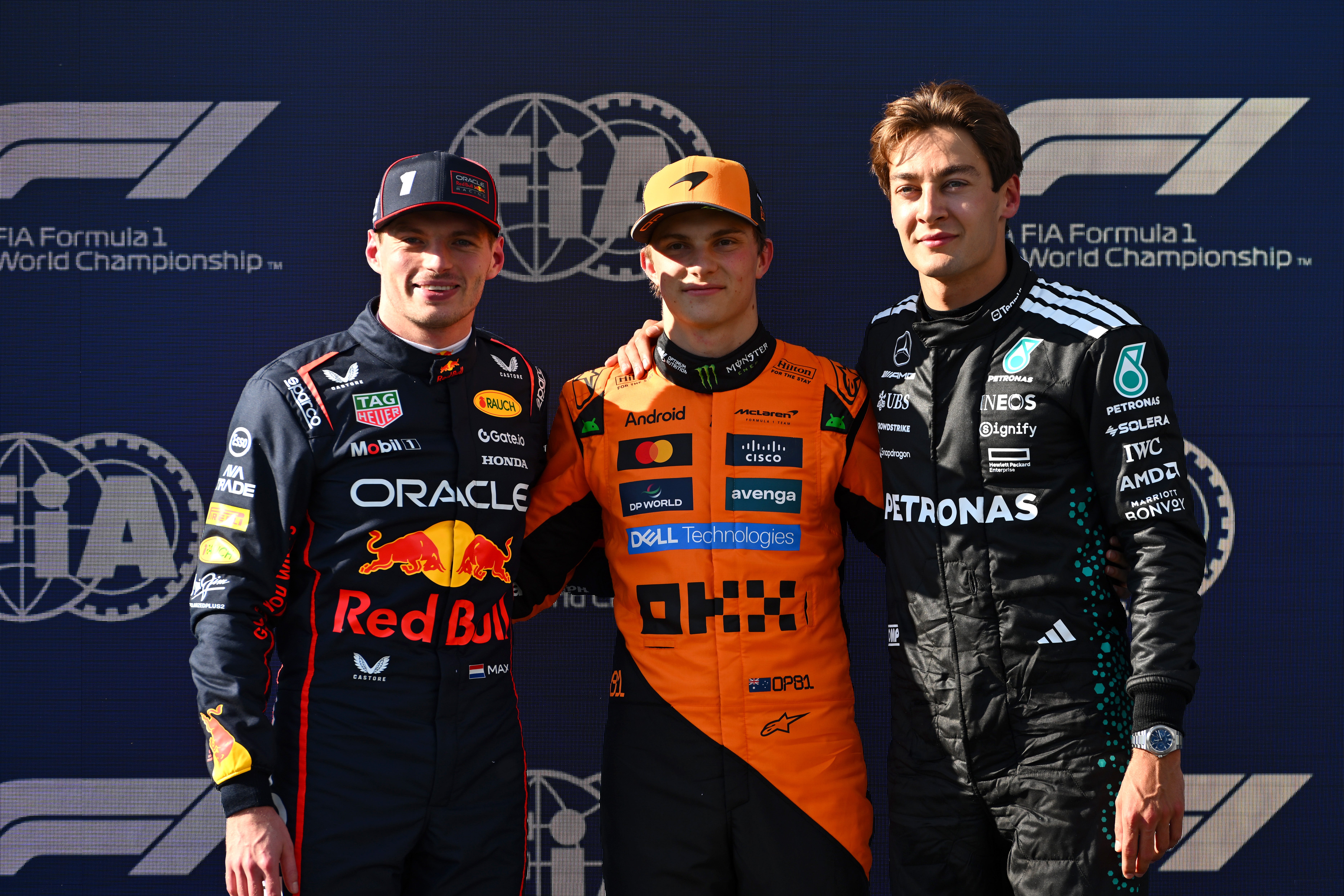 Oscar Piastri (centre) takes pole position