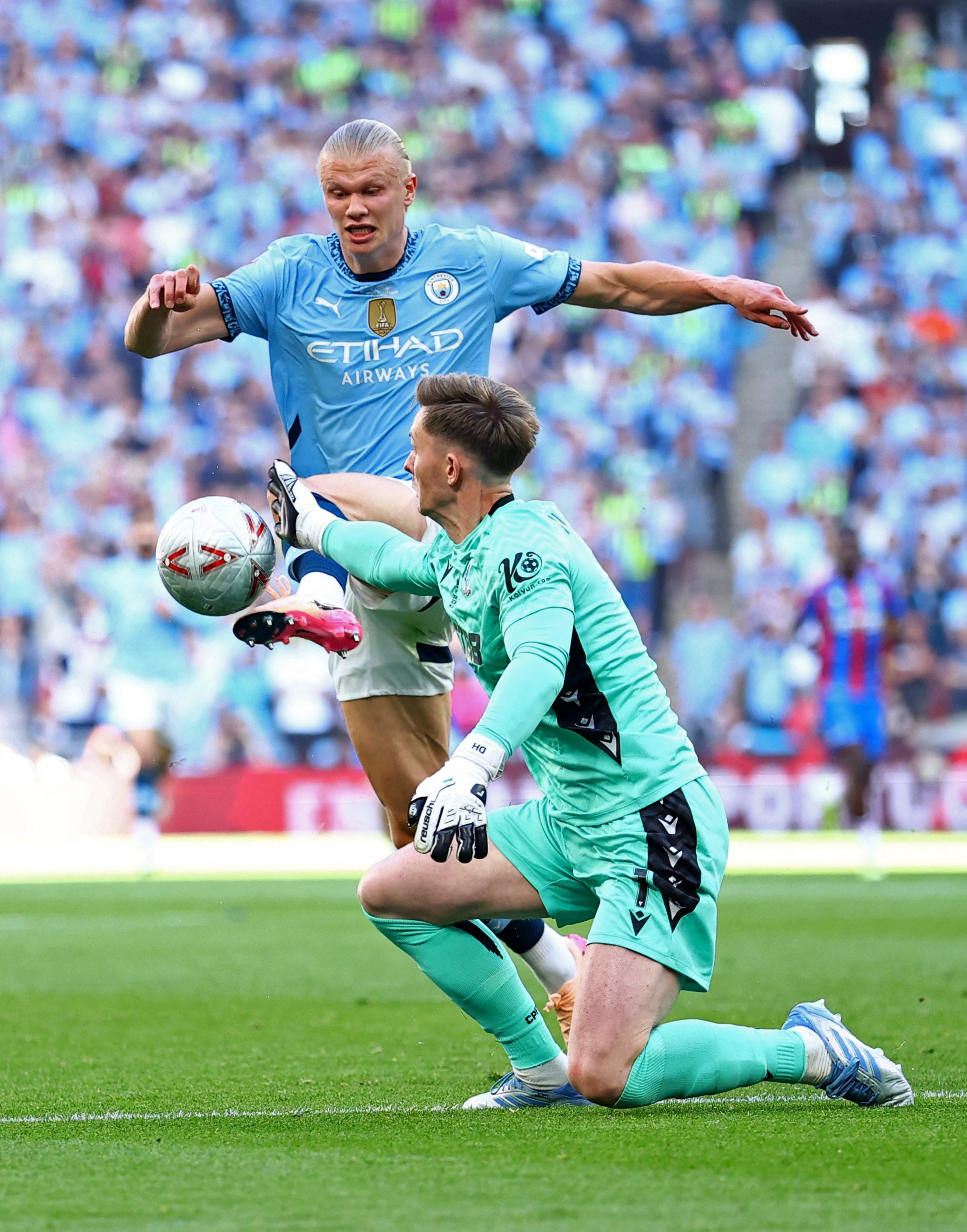 Manchester City's Erling Haaland in action with Crystal Palace's Dean Henderson