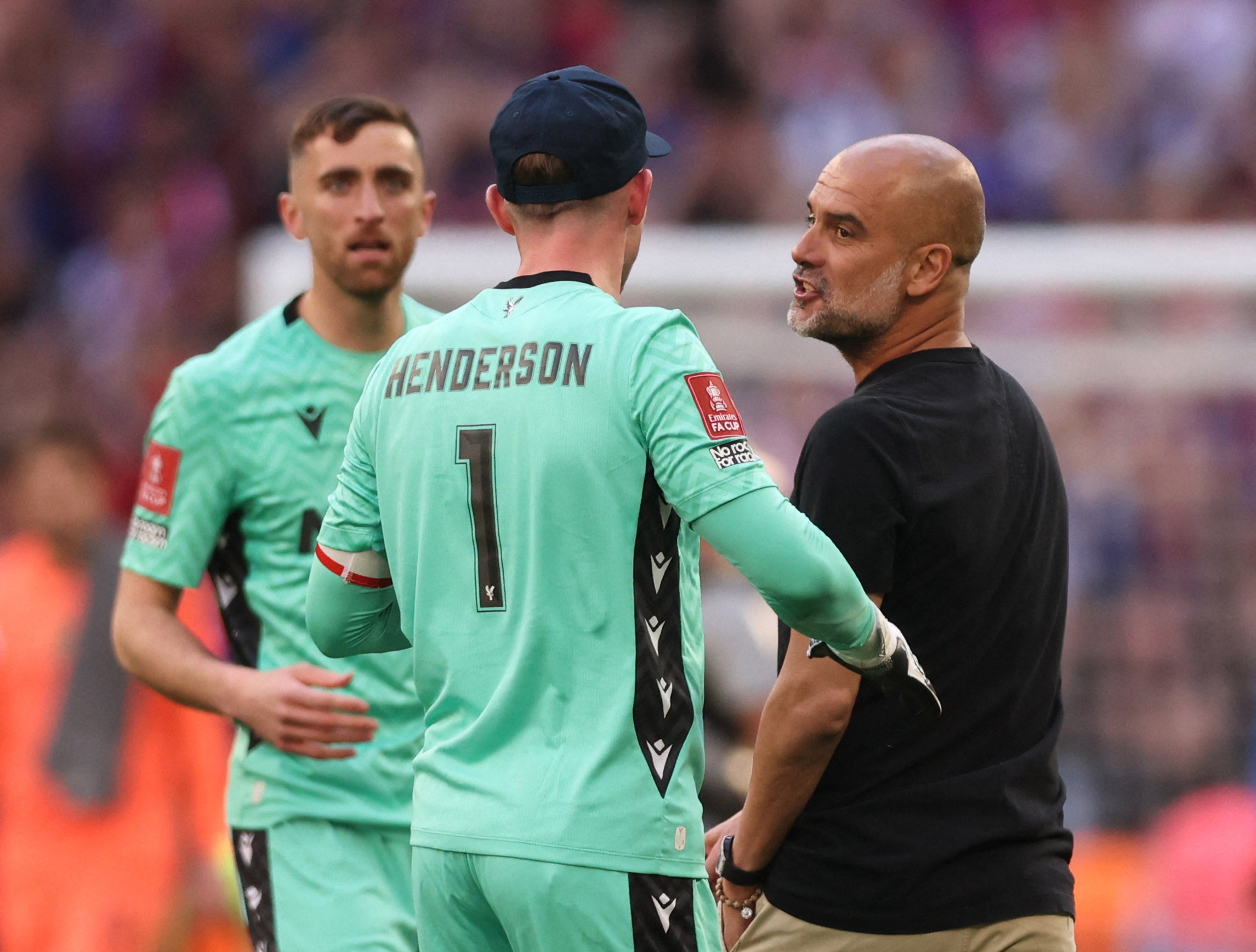 Guardiola appeared to confront Henderson at full-time