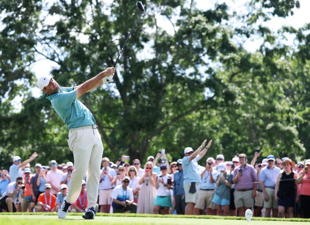 <p>Scottie Scheffler in action on the ninth tee</p>
