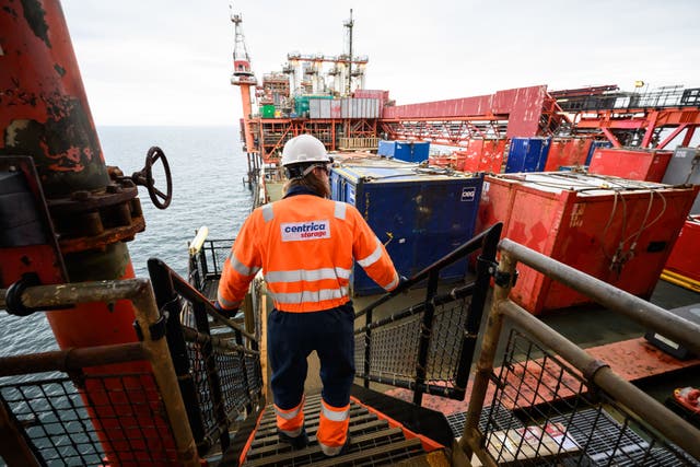 A member of the Centrica crew walks along a gangway on the the Rough 47/3B Bravo gas platform in the North Sea (Leon Neal / PA).
