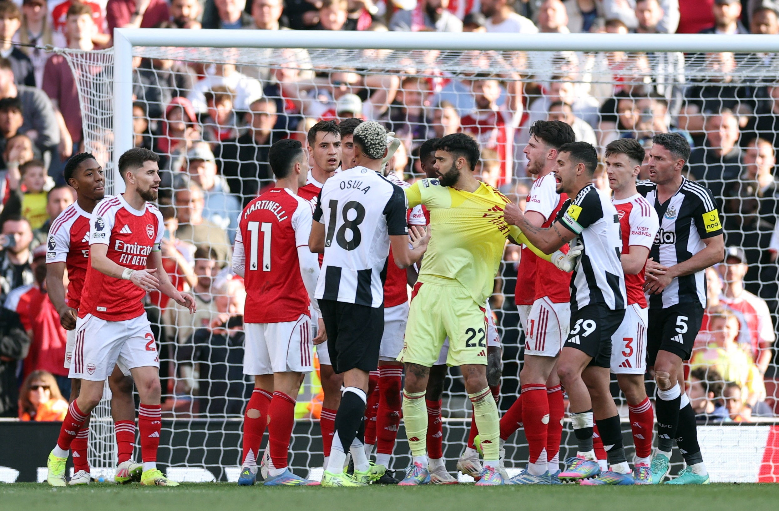 David Raya (centre, wearing yellow) was Arsenal’s immovable force against Newcastle