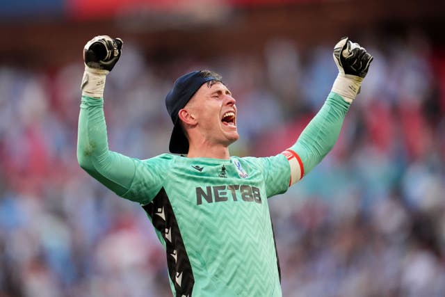 Crystal Palace goalkeeper Dean Henderson celebrates their FA Cup final win (Adam Davy/PA).