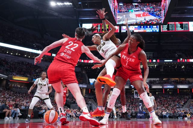 <p>Indiana Fever guard Caitlin Clark, left, battles for the ball with Chicago Sky forward Angel Reese</p>
