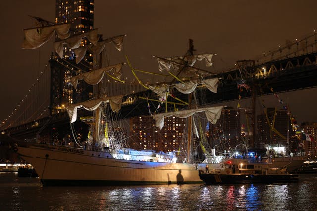 <p>A New York Police Department harbor unit prepares to board the Cuauhtamoc, a masted Mexican Navy training ship that collided with the Brooklyn Bridge</p>