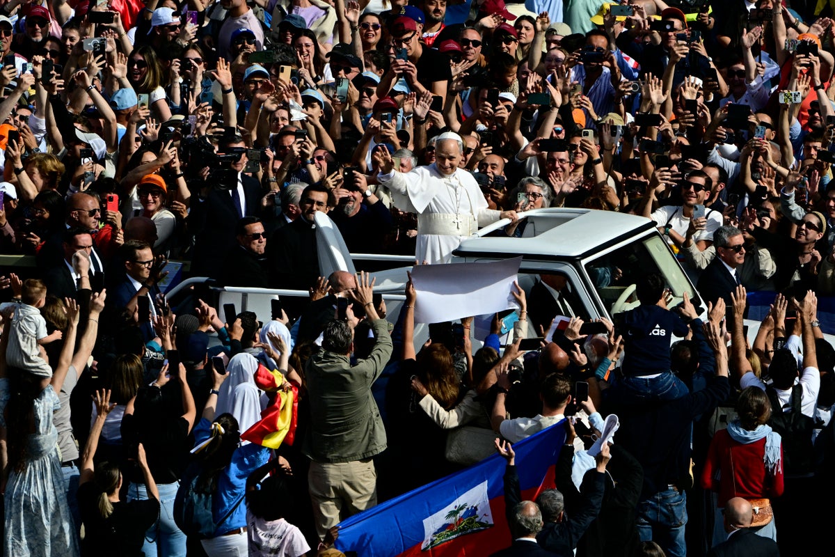 Pope Leo holding inaugural mass at the Vatican in front of thousands as crowds chant ‘Viva il Papa’
