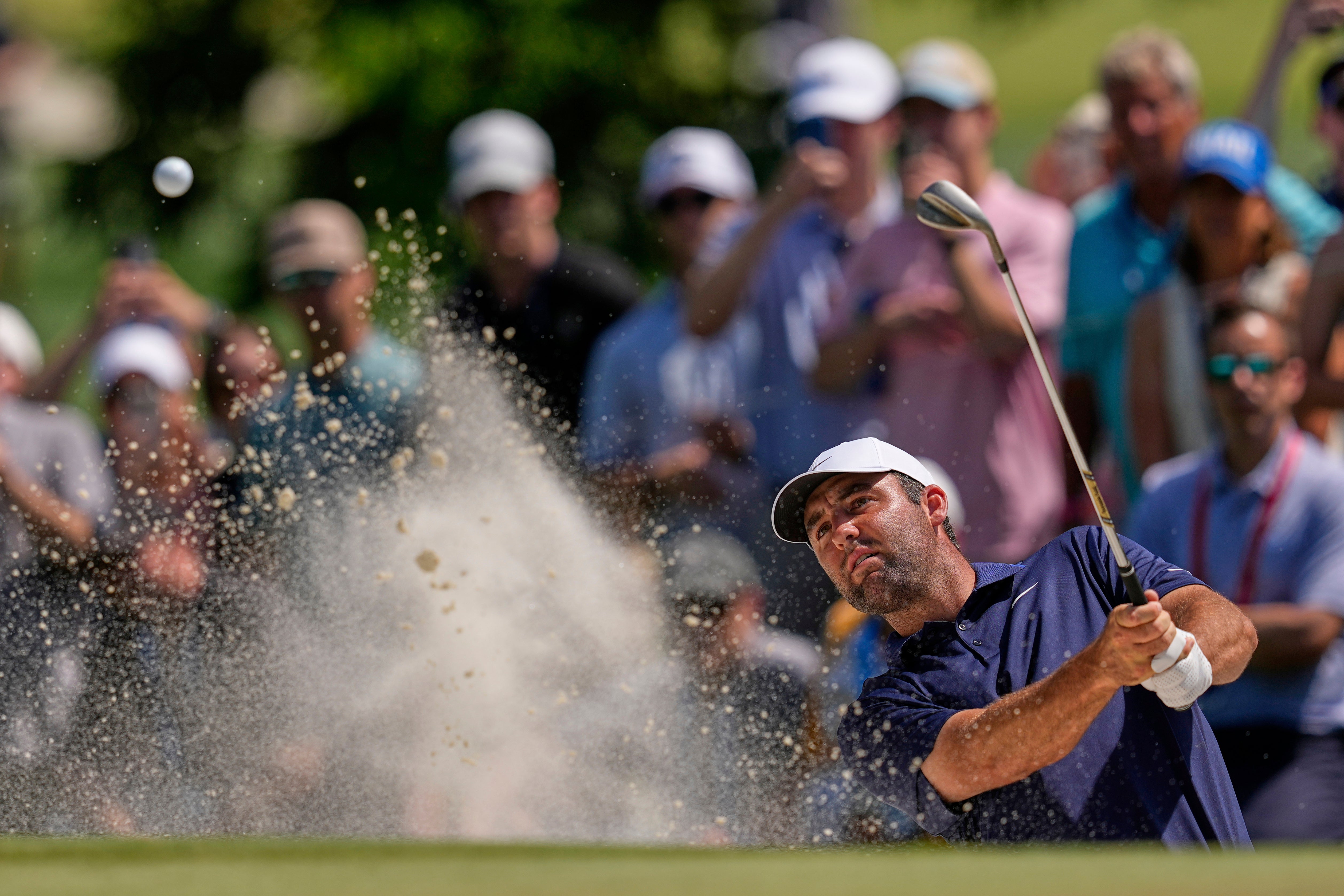 Scottie Scheffler hits from a bunker during the final round of the US PGA Championship (David J. Phillip/AP)