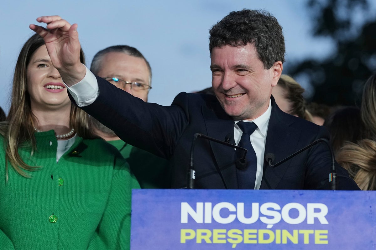 AP PHOTOS: Pro-EU centrist wins Romania’s tense presidential race over hard-right nationalist