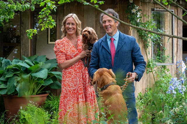 <p>Monty Don and Sophie Raworth pose with their dogs at the 2025 Chelsea Flower Show on Monday 19 May</p>