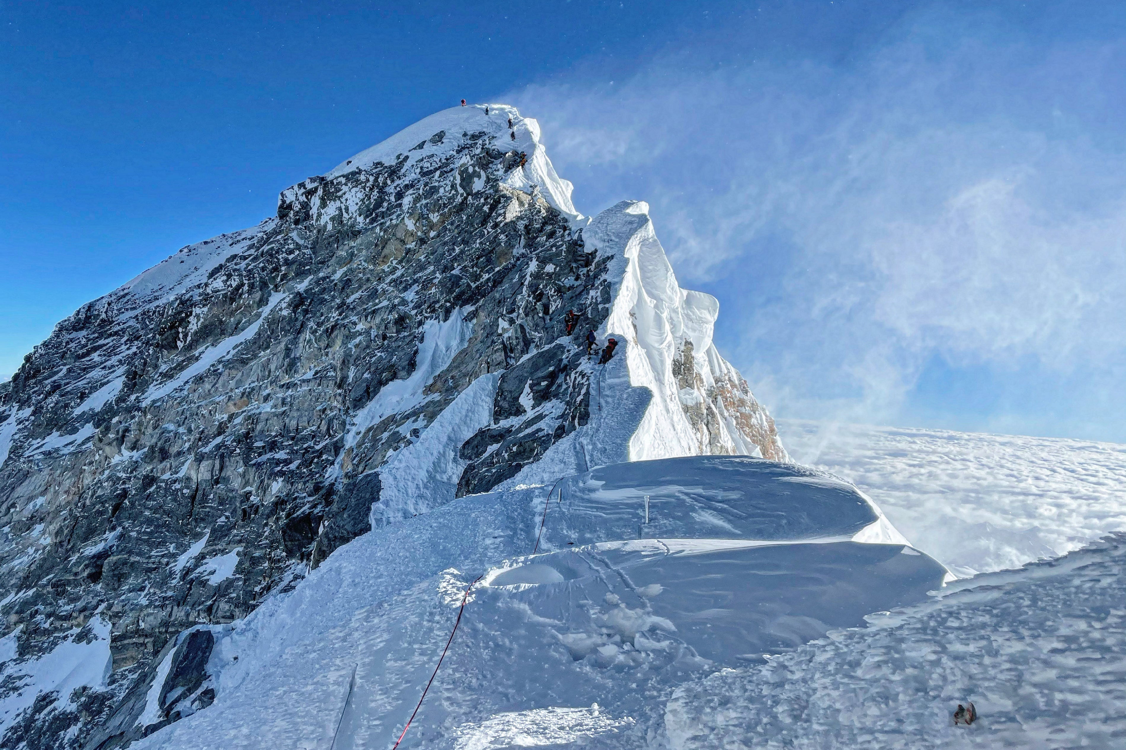 Mountaineers climbing the Hillary Step during their ascend of the South face to summit Mount Everest (8,848.86-metre), in Nepal