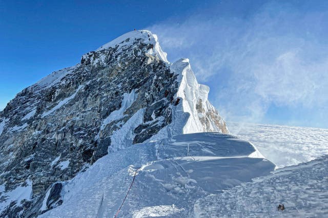 <p>Mountaineers climbing the Hillary Step during their ascend of the South face to summit Mount Everest (8,848.86-metre), in Nepal</p>