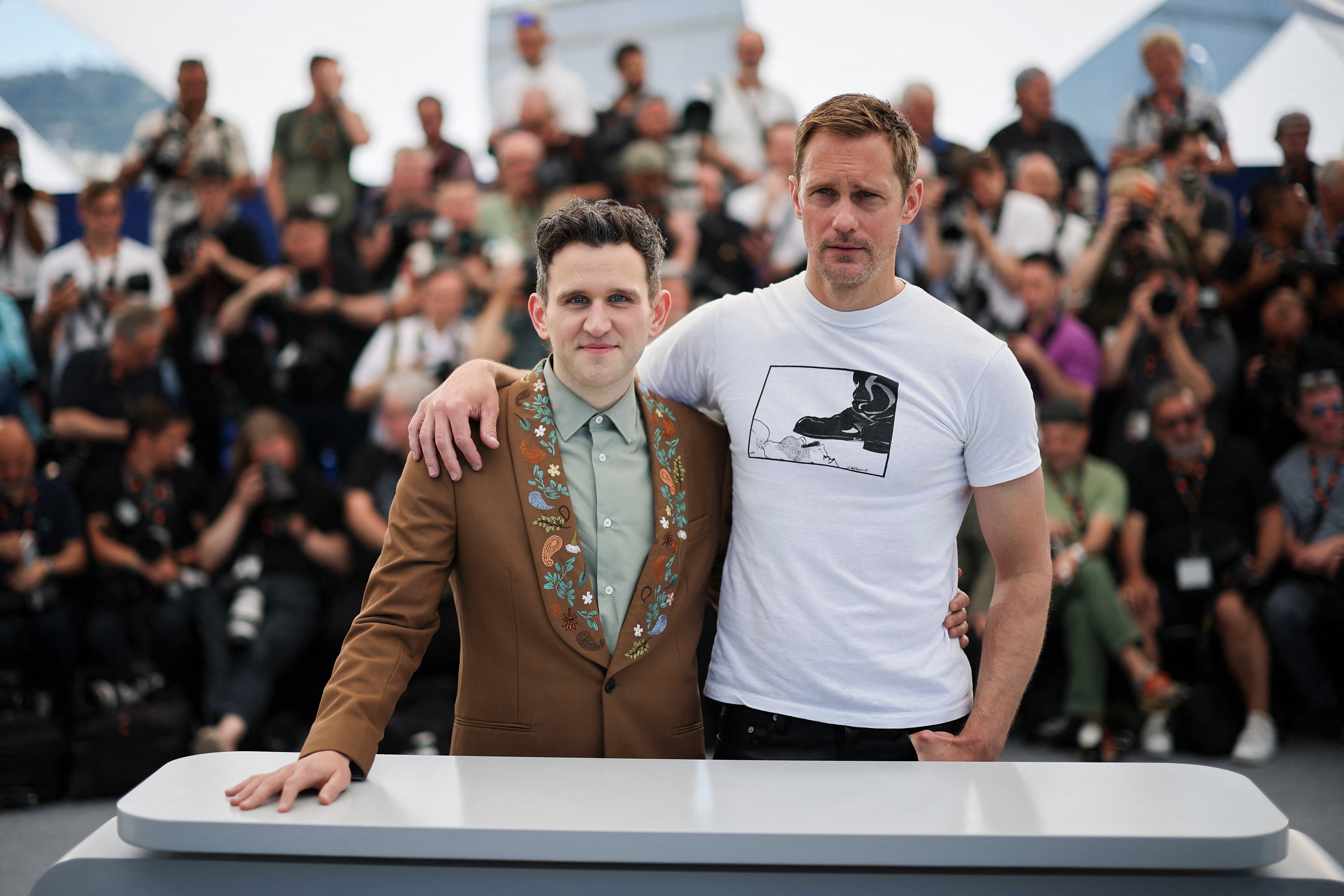 Cast members Alexander Skarsgard and Harry Melling pose during a photocall for the film