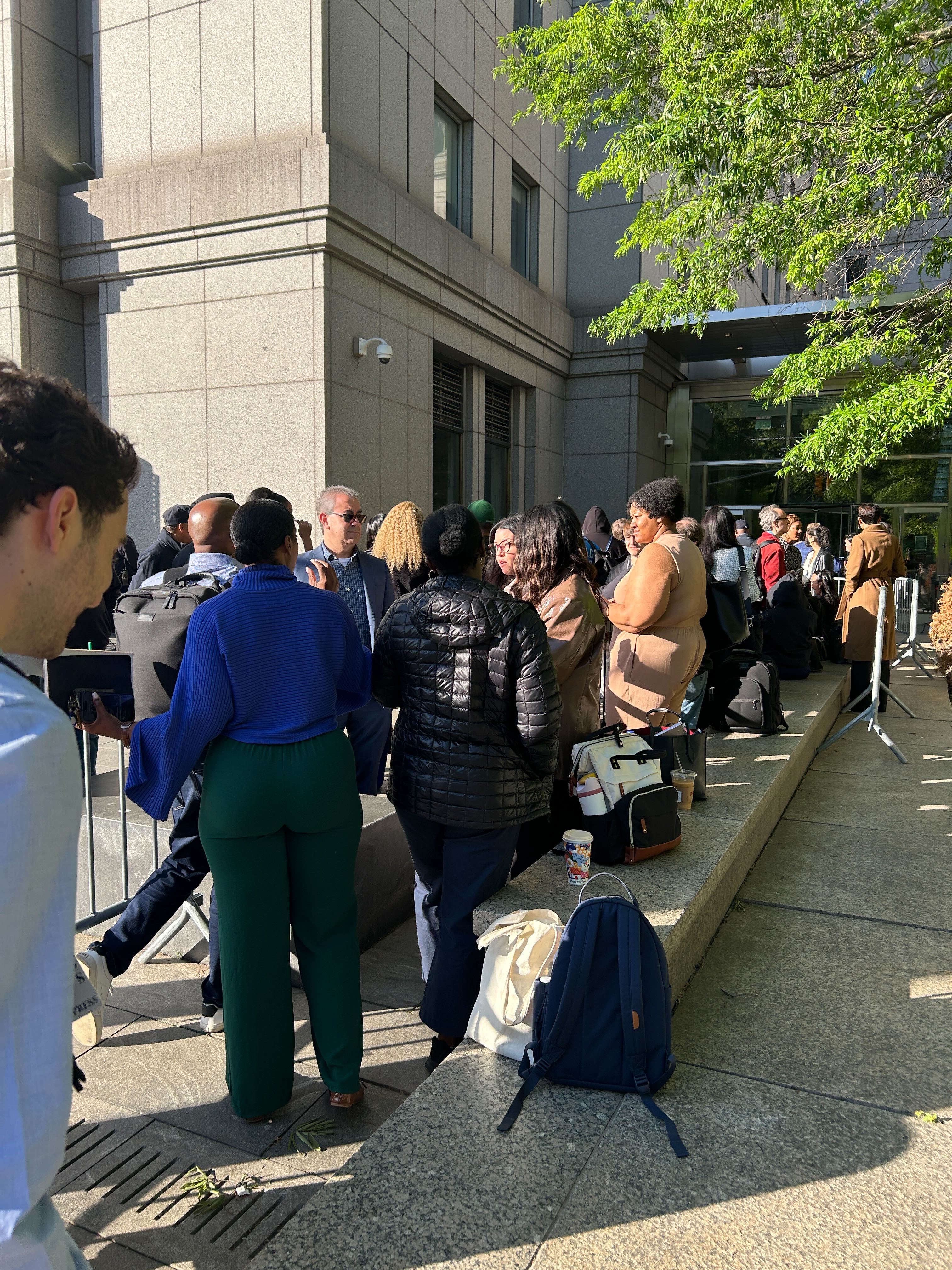 Media and the public queued outside court for the Sean 