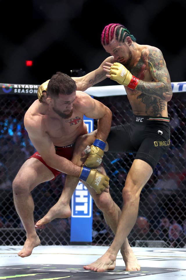 <p>Sean O’Malley (right) during his title loss to Merab Dvalishvili</p>