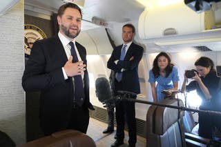 Vice president JD Vance talks to reporters on board of the Air Force Two at Leonardo da Vinci International Airport in Rome