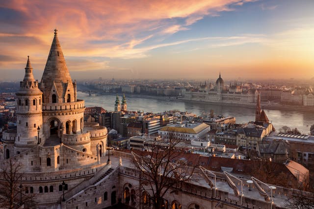 <p>The Hungarian Parliament building and River Danube in Budapest at sunrise</p>