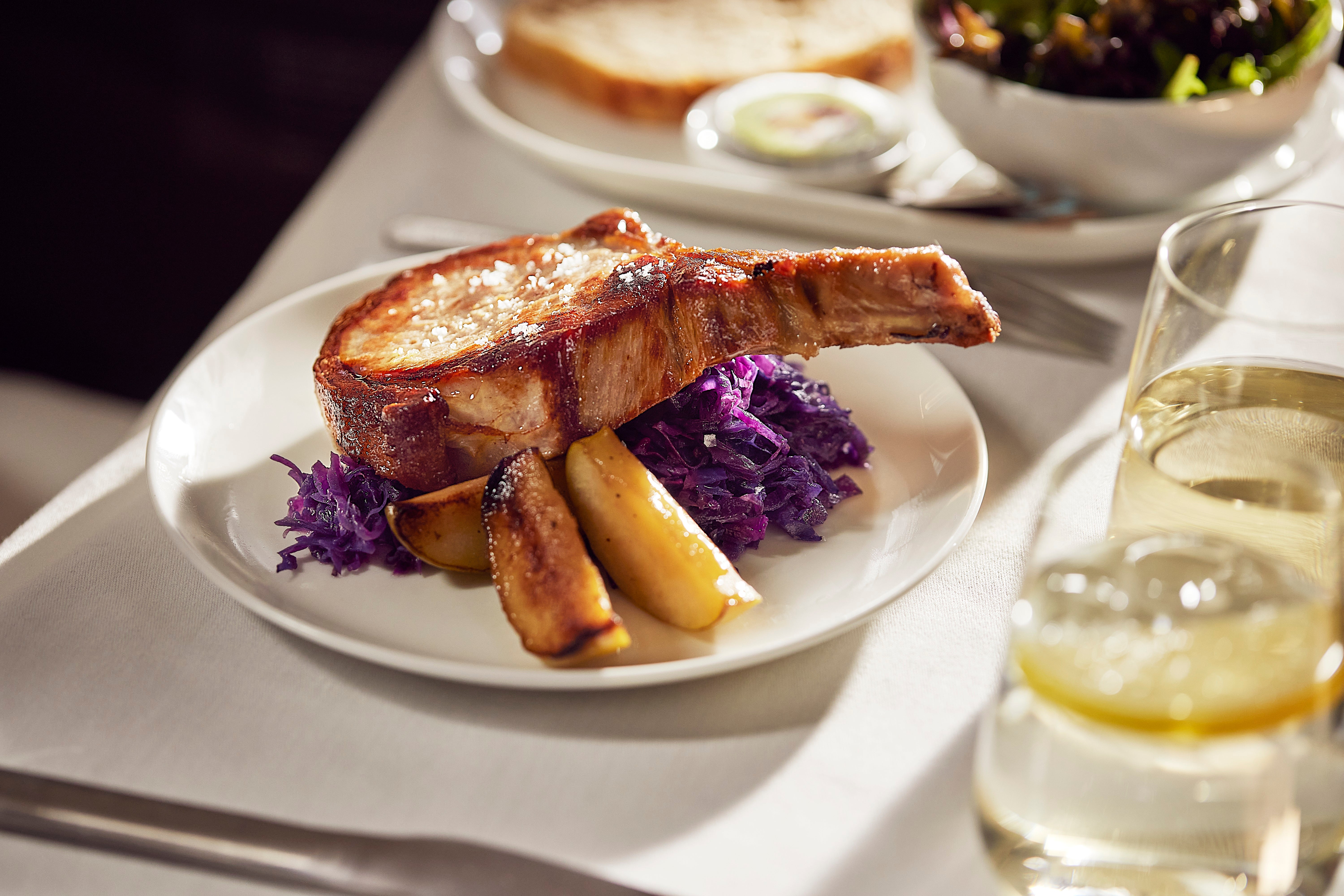 Aussie produce served alongside sommerlier-selected wines are par for the course on your Qantas flight (presentation may vary, image shows Business class meal)