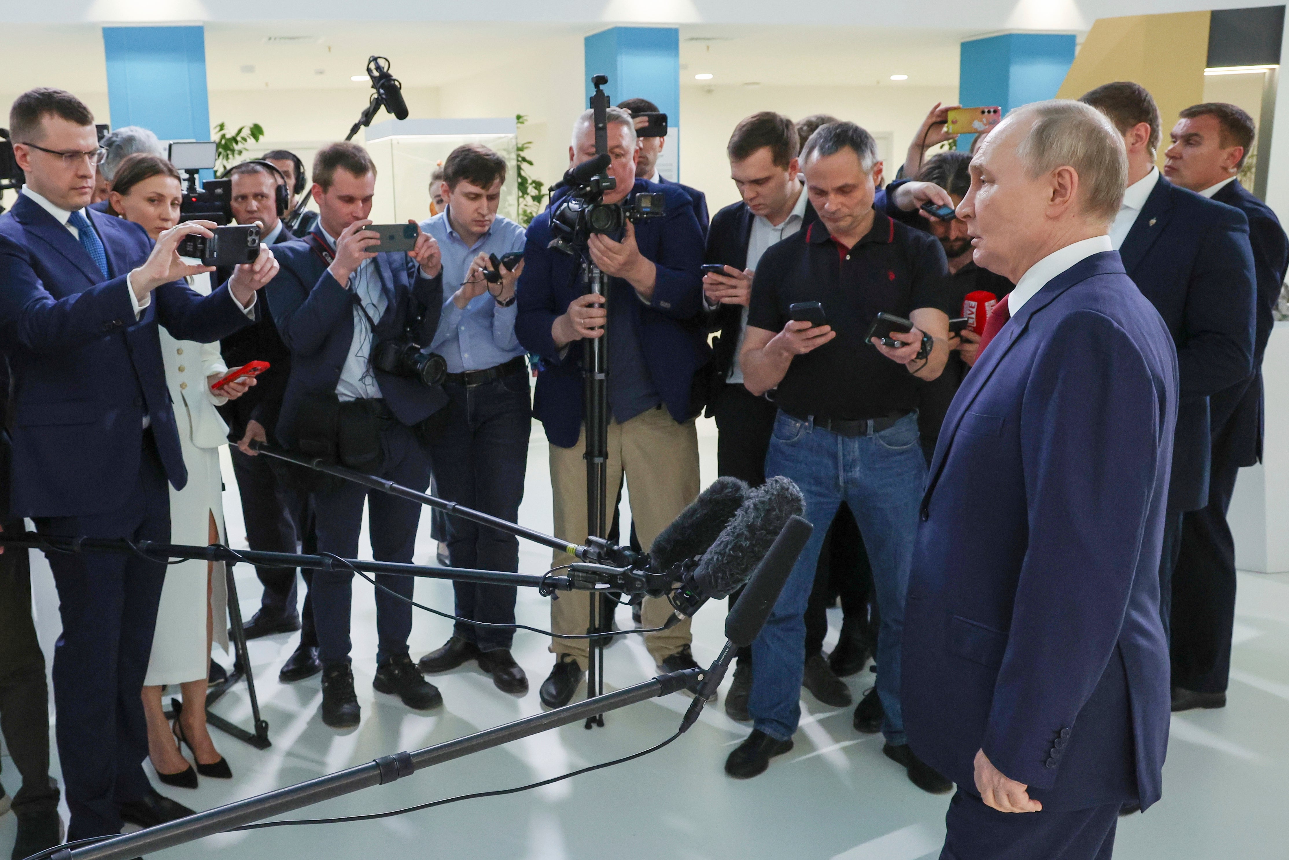 Vladimir Putin addresses the media after his two-hour phone call with Donald Trump on Monday