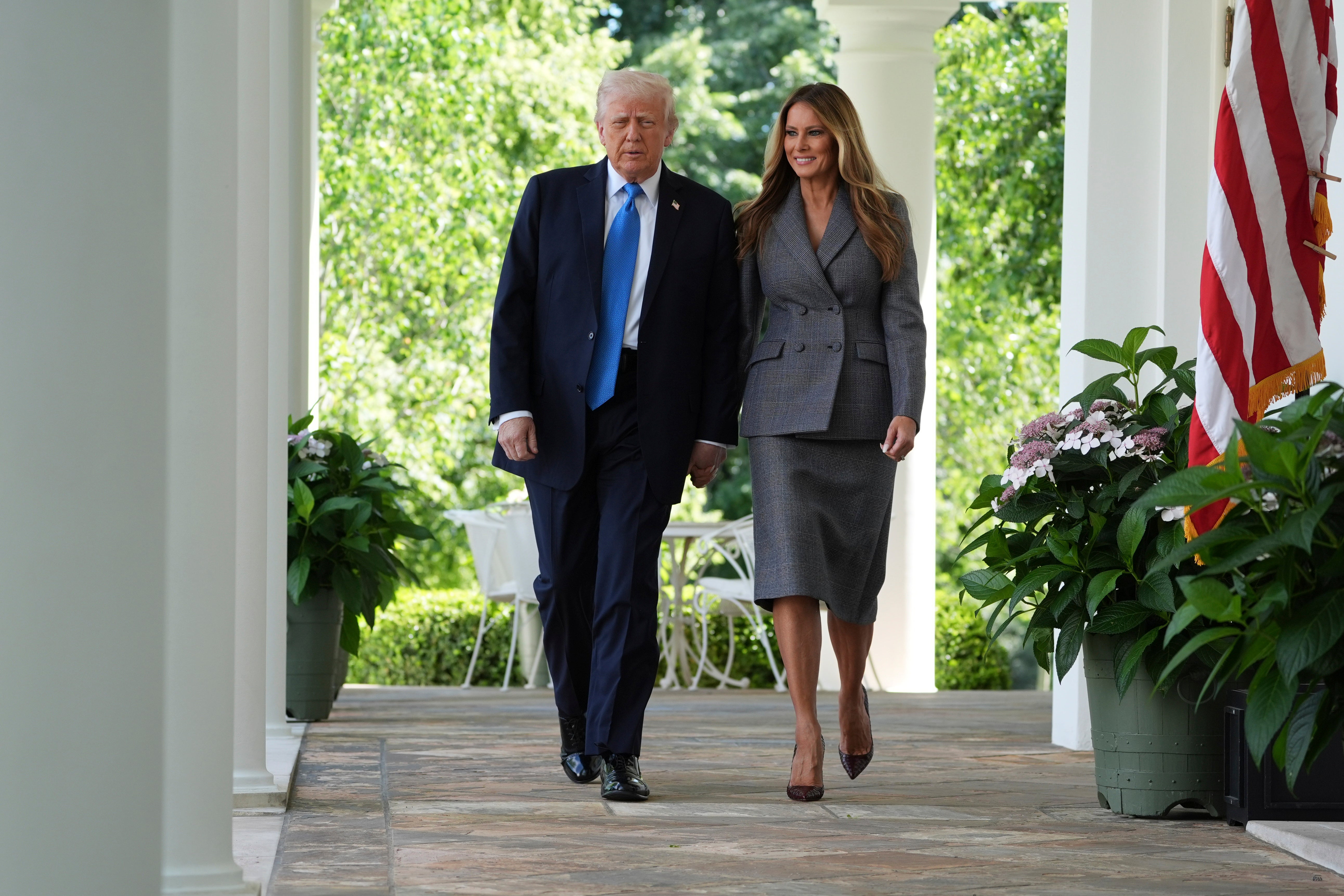 President Donald Trump, left, and first lady Melania Trump arrive to speak during a bill signing event for the "Take it Down Act" in the Rose Garden of the White House, Monday, May 19, 2025, in Washington. (AP Photo/Evan Vucci)