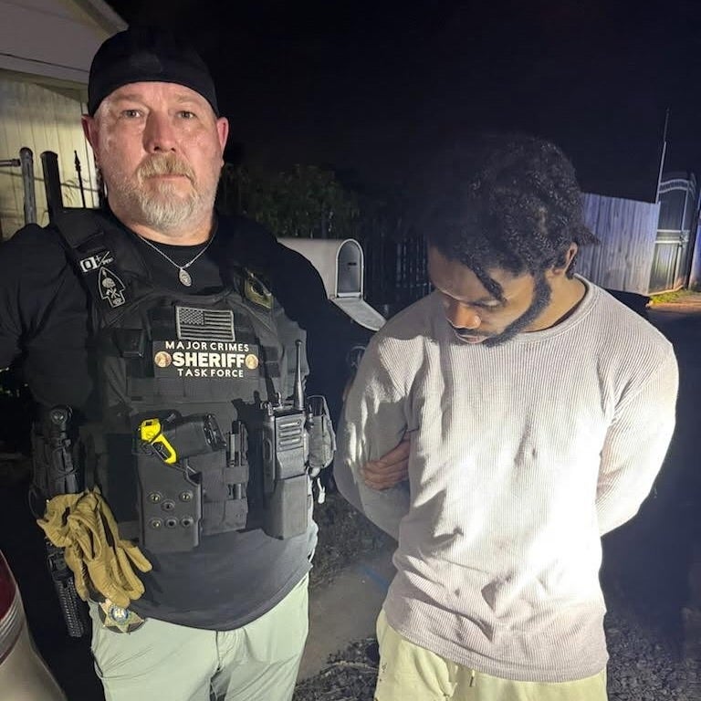An Orleans Parish Sheriff's Office deputy arrests Dkenan Dennis, one of 10 men who escaped a New Orleans jail on May 16