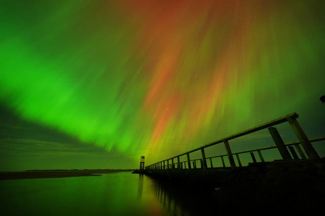 <p>The Northern Lights in Northumberland (Owen Humphreys/PA</p>