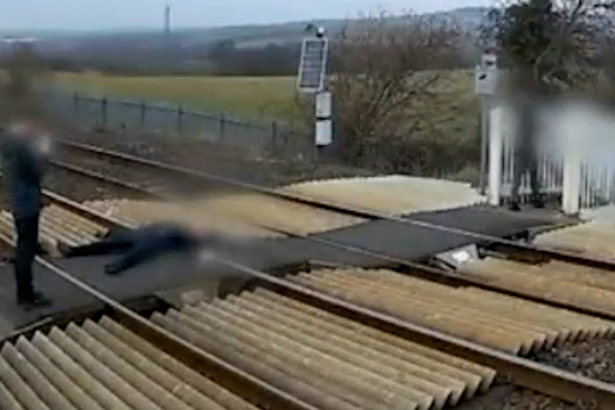 CCTV of trespassers lying across train tracks leads rail company to issue immediate closure